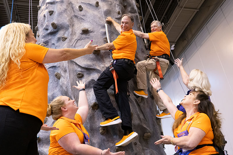 David and Lew of Abilities Expo, climbing the adaptive wall.