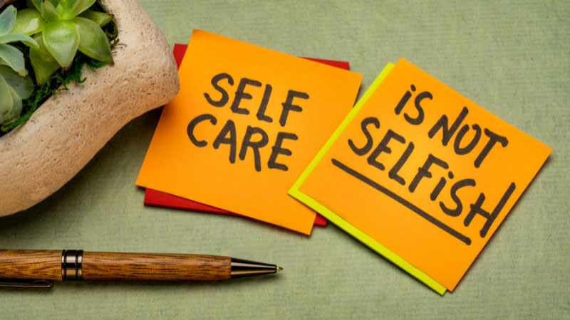 Photo of post-it notes showing the text "Self Care is No Selfish".